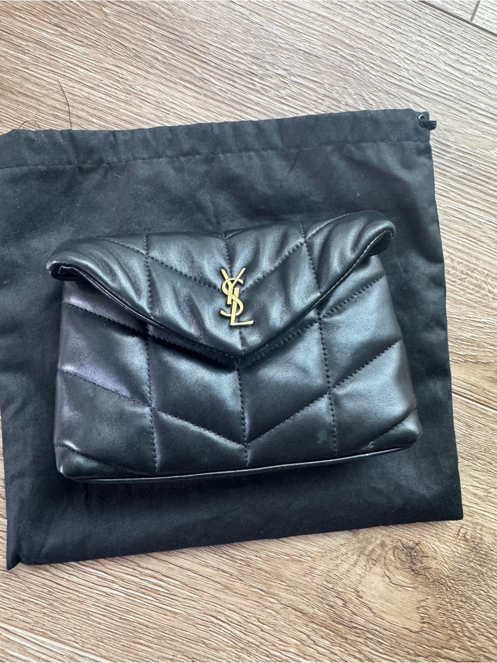 Saint Laurent Black Quilted Lambskin Clutch with Gold YSL Accent
Small